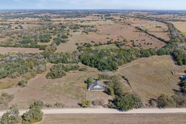 an aerial view of mountain with beach