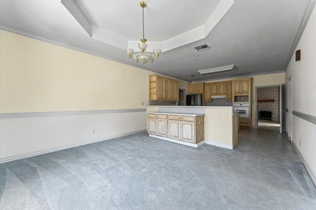 a view of a kitchen with a sink and dishwasher