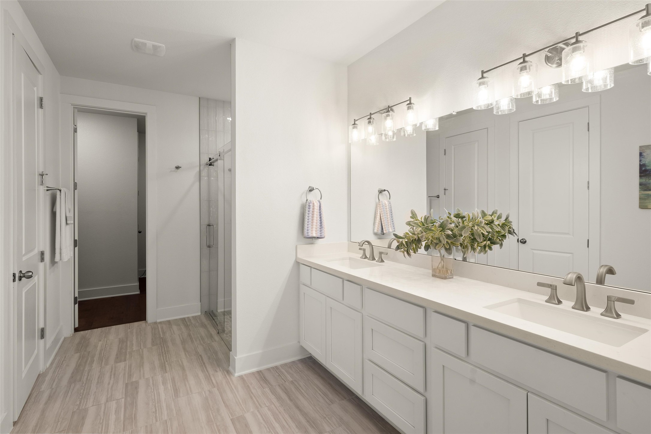 299 Tierra Trail Dripping Springs, TX 78620 - Photo 24 of 40 a bathroom with a double vanity sink mirror and shower