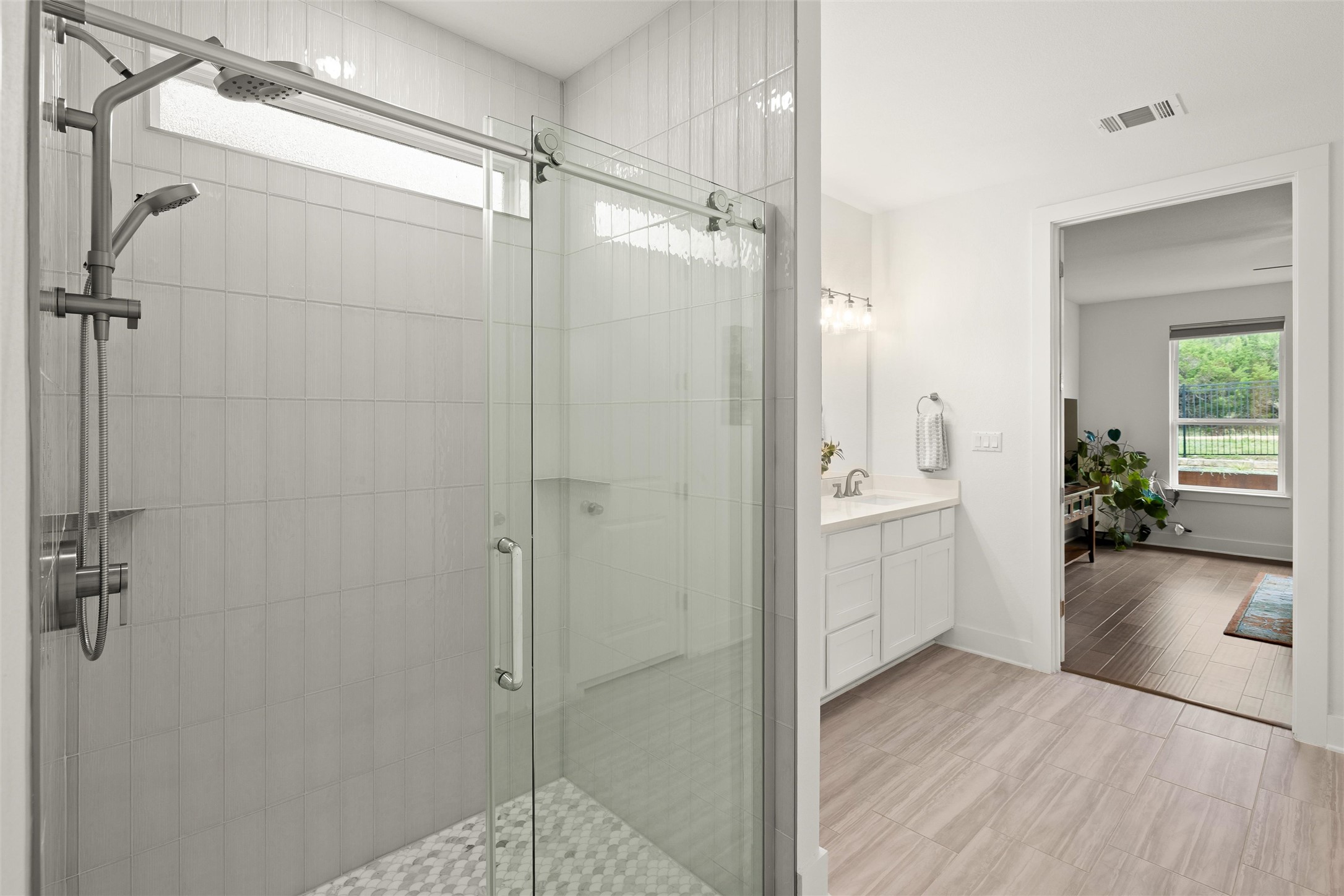 299 Tierra Trail Dripping Springs, TX 78620 - Photo 25 of 40 a bathroom with a shower and a sink