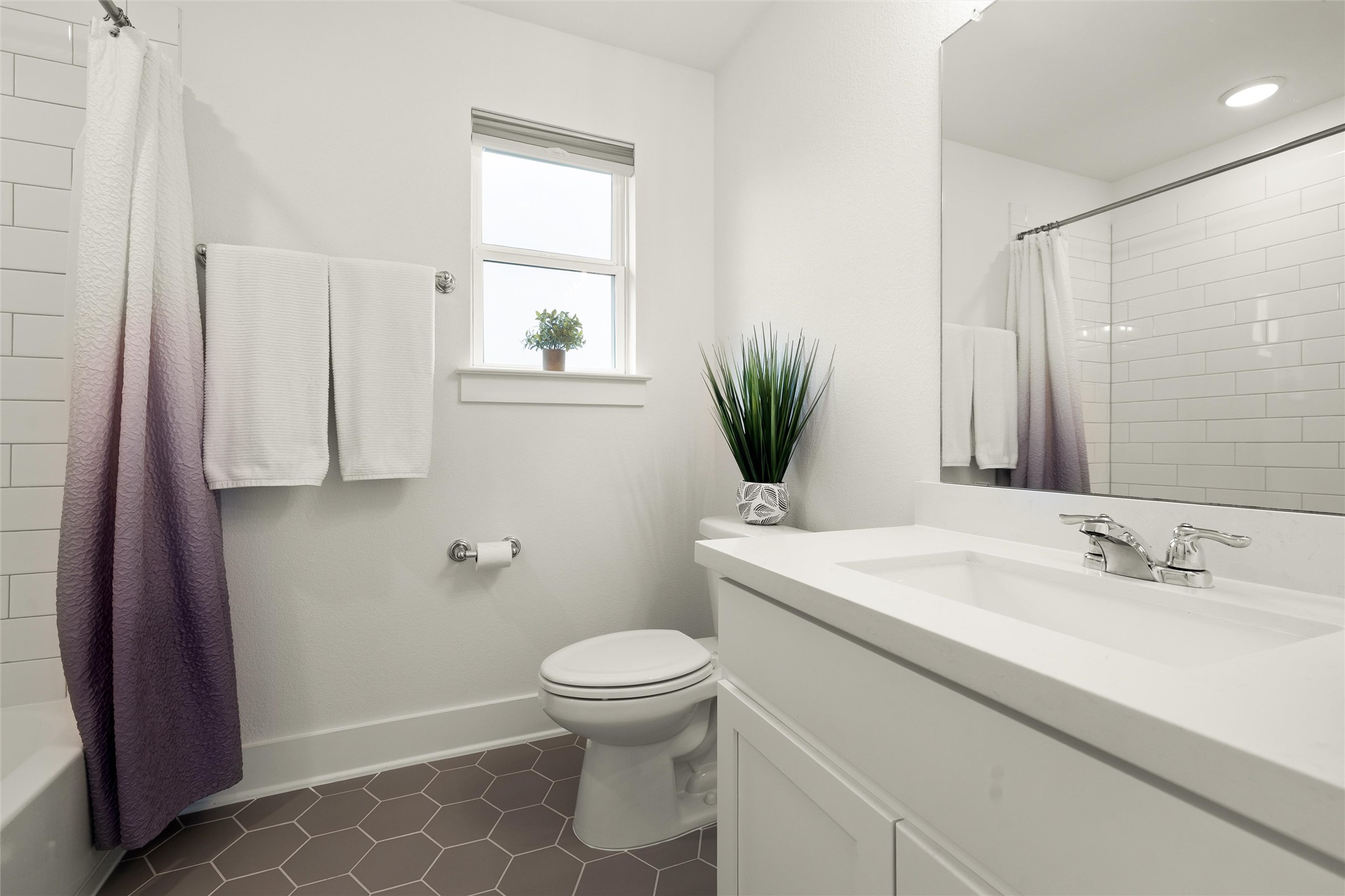 299 Tierra Trail Dripping Springs, TX 78620 - Photo 29 of 40 a bathroom with a sink a toilet and tub