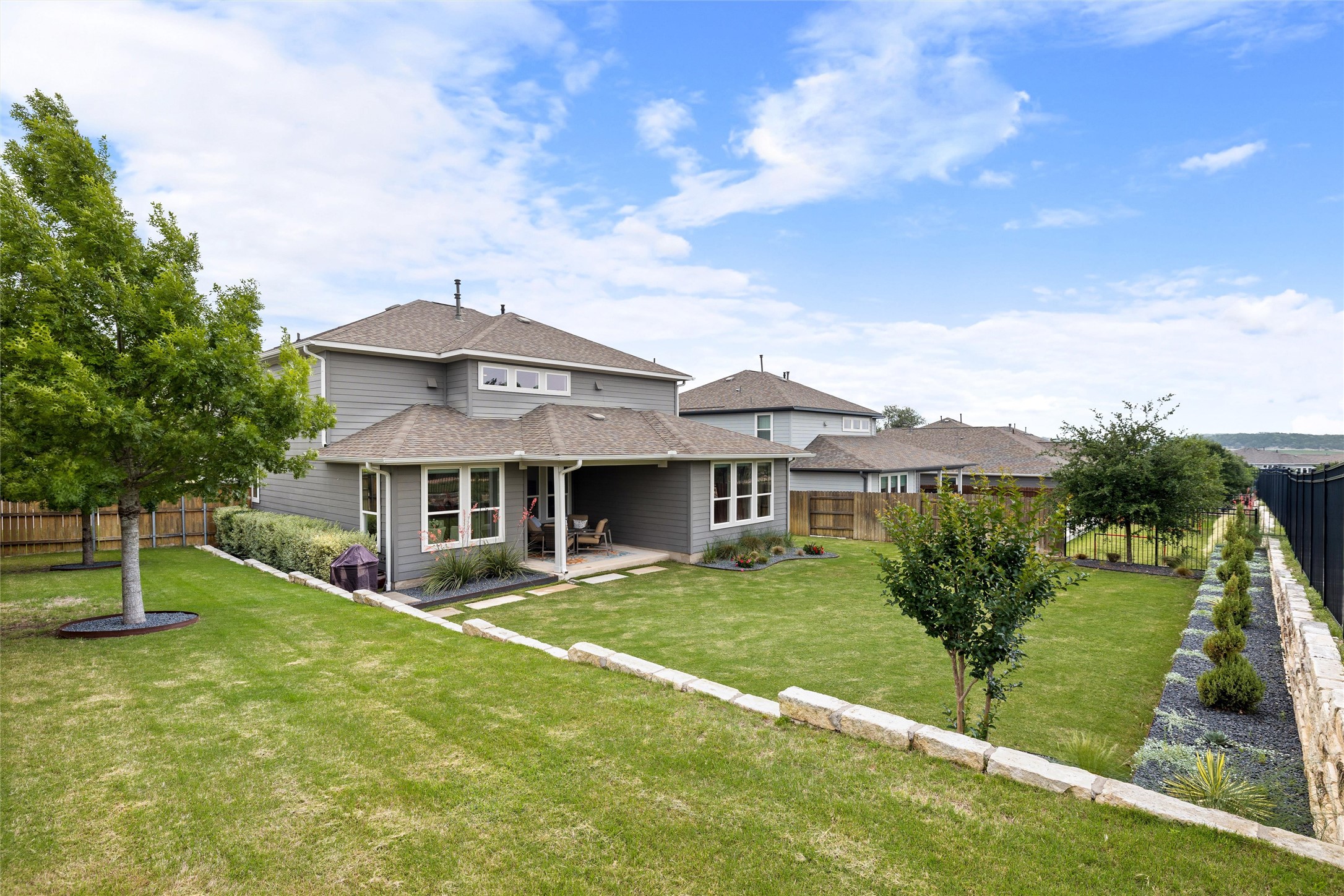 299 Tierra Trail Dripping Springs, TX 78620 - Photo 36 of 40 front view of a house with a yard