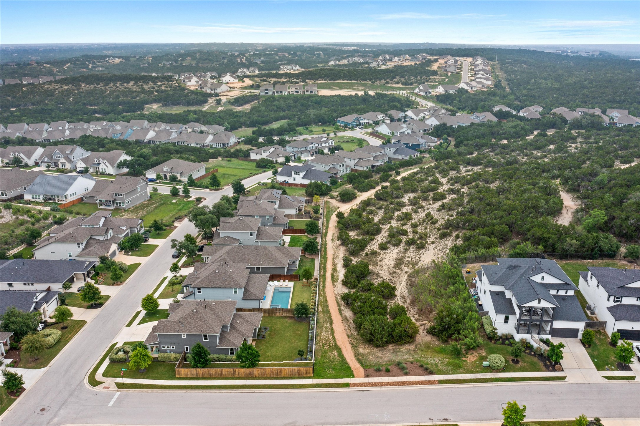 299 Tierra Trail Dripping Springs, TX 78620 - Photo 40 of 40 an aerial view of residential houses with outdoor space