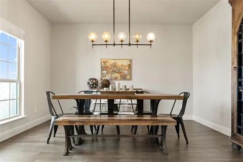 a kitchen with granite countertop a sink a counter top space appliances and cabinets