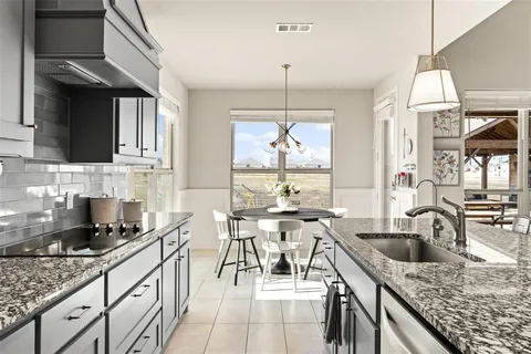 a living room with furniture and a book shelf