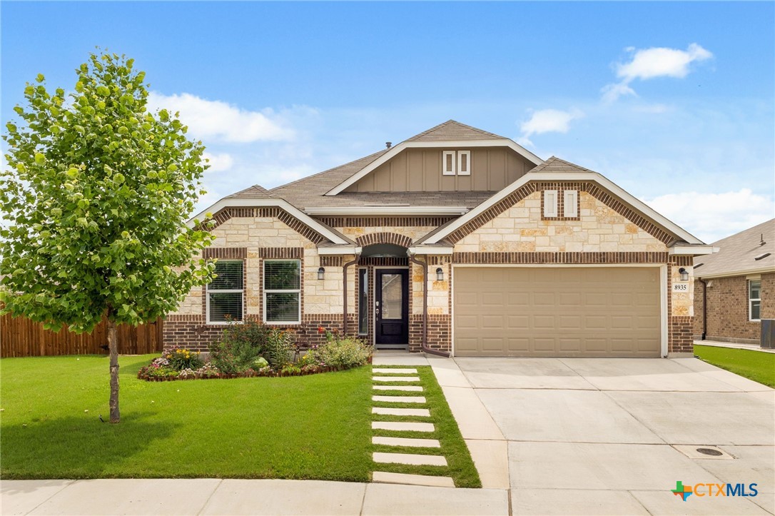 8935 Rancher Place Seguin, TX 78155 - Photo 1 of 32 Front with extended walk and driveway
