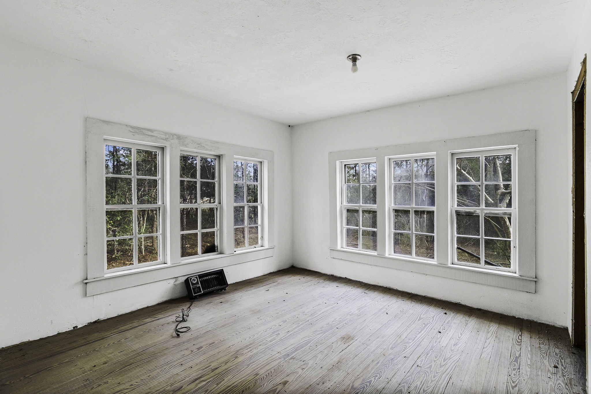 4826 Old Israel Road Livingston, TX 77351 - Photo 21 of 37 an empty room with wooden floor and windows