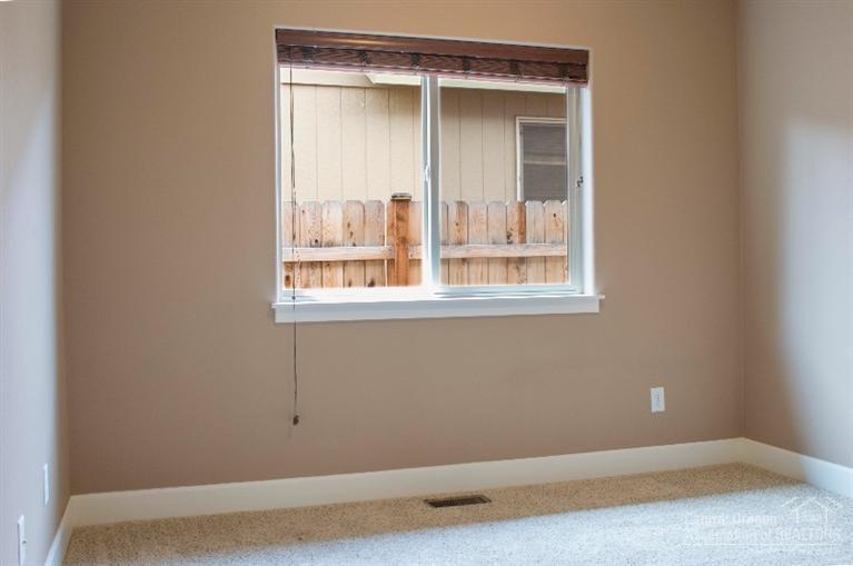 61723 Rigel Way Bend, OR 97702 - Photo 15 of 17 a view of an empty room with a window