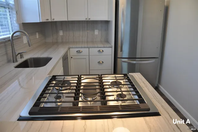 a kitchen with wooden cabinets