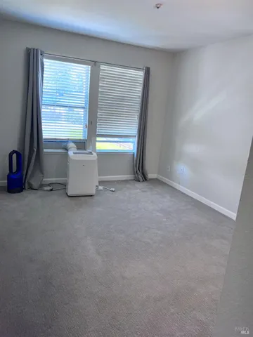 a view of room with window and furniture