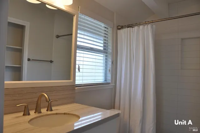 a bathroom with a sink and a mirror