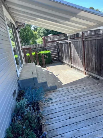 a view of outdoor space with wooden floor and staircase