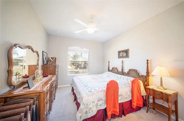 a dining room with furniture and a chandelier