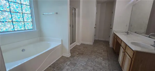 a bathroom with a sink and a bathtub