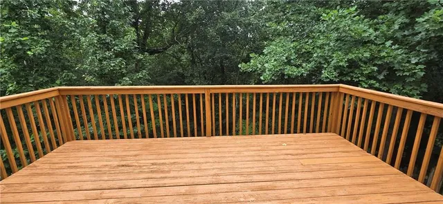a balcony with view of wooden floor