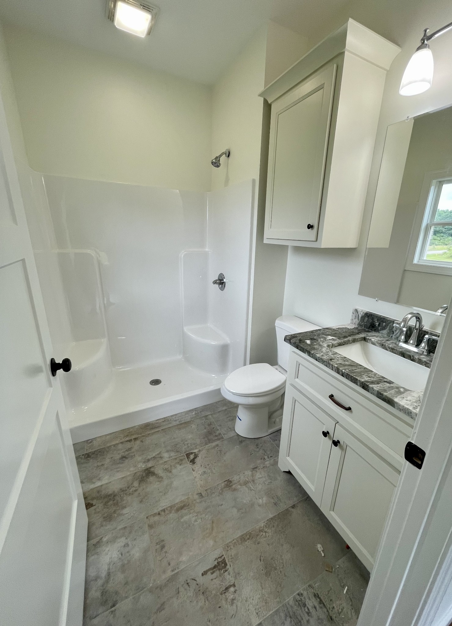 58 Union Hill Road Loretto, TN 38469 - Photo 5 of 13 a bathroom with a granite countertop sink a toilet and bathtub