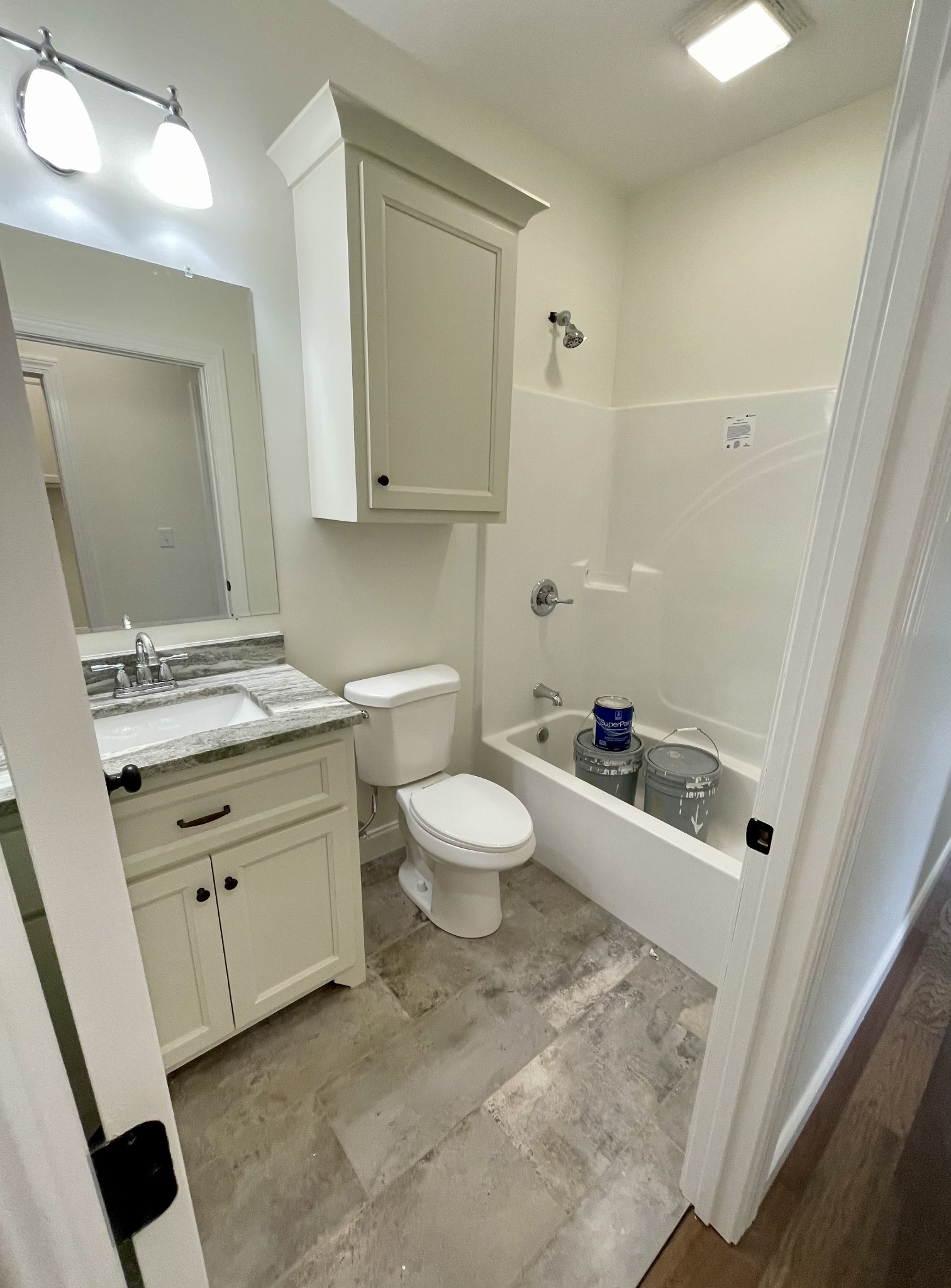 58 Union Hill Road Loretto, TN 38469 - Photo 7 of 13 a bathroom with a granite countertop sink toilet a mirror and vanity