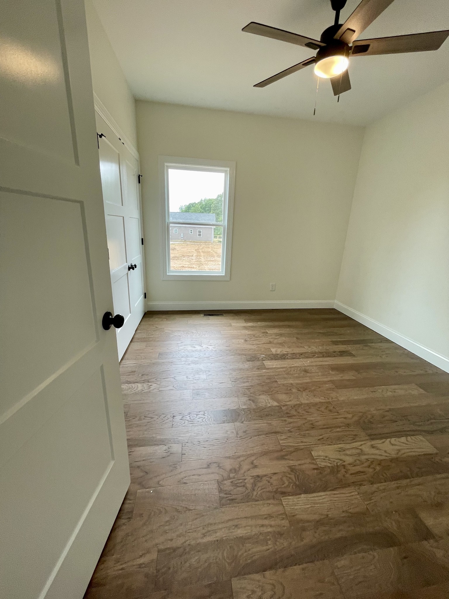 58 Union Hill Road Loretto, TN 38469 - Photo 8 of 13 an empty room with windows and fan