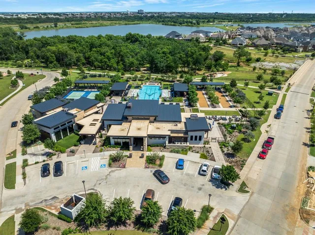 an aerial view of a city with lake view