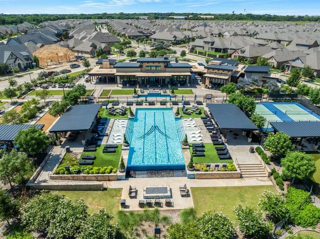an aerial view of a residential apartment building with a yard