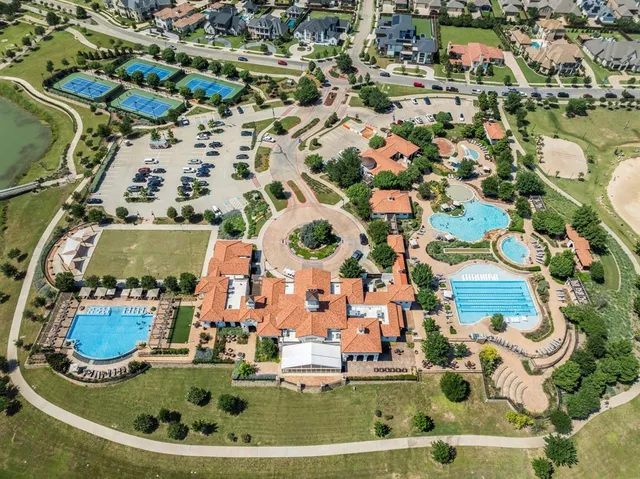 an aerial view of a house with a swimming pool
