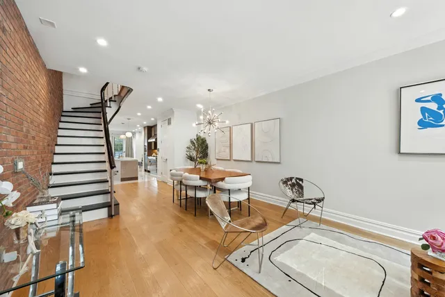 a view of a livingroom with furniture and wooden floor