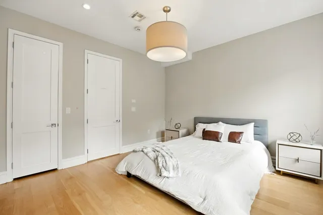 a bedroom with a bed and a closet