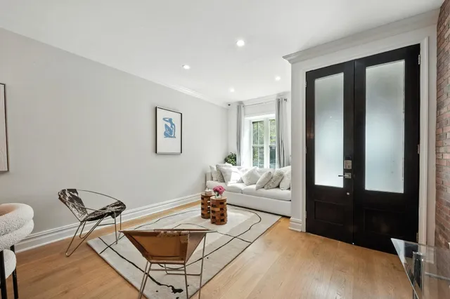 a living room with furniture and a window