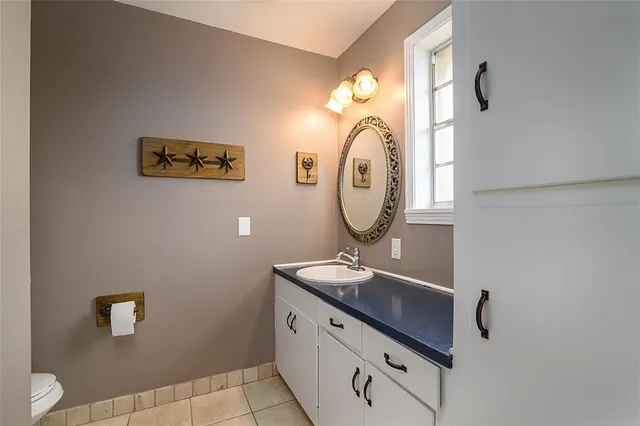 a bathroom with a toilet and a sink