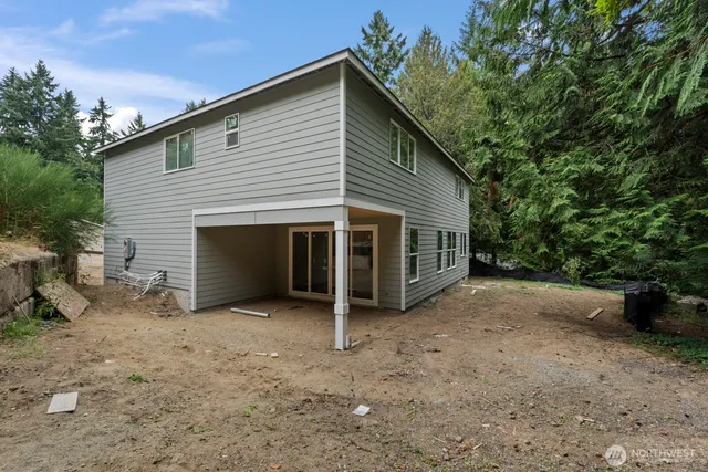 a view of a house with a yard and garage