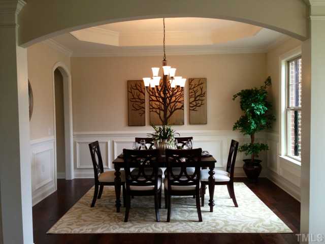 5108 Accabonac Point Raleigh, NC 27612 - Photo 4 of 25 with arched passageways, tray ceiling and beautiful trim detail