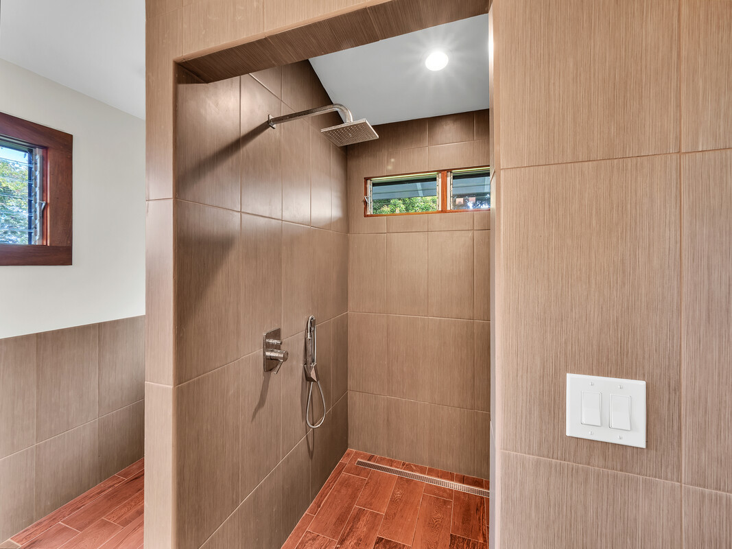 46 Kokea Street Hilo, HI 96720 - Photo 19 of 29 a bathroom with a shower and a glass door