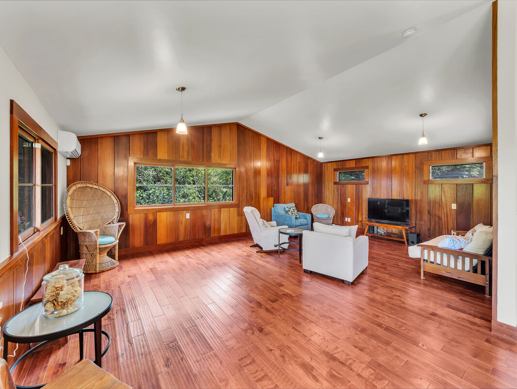 46 Kokea Street Hilo, HI 96720 - Photo 3 of 29 a living room with furniture and a wooden floor