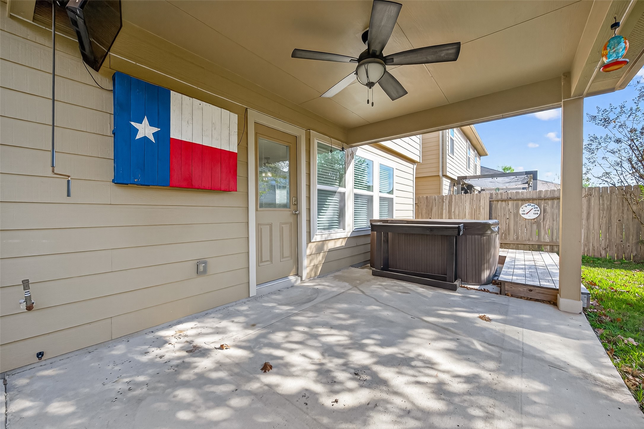 9940 Swallow Drive Conroe, TX 77385 - Photo 25 of 30 Covered patio with outdoor ceiling fan and TV