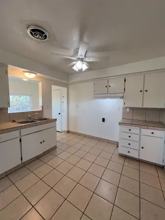 a kitchen with stainless steel appliances cabinets a sink and a stove