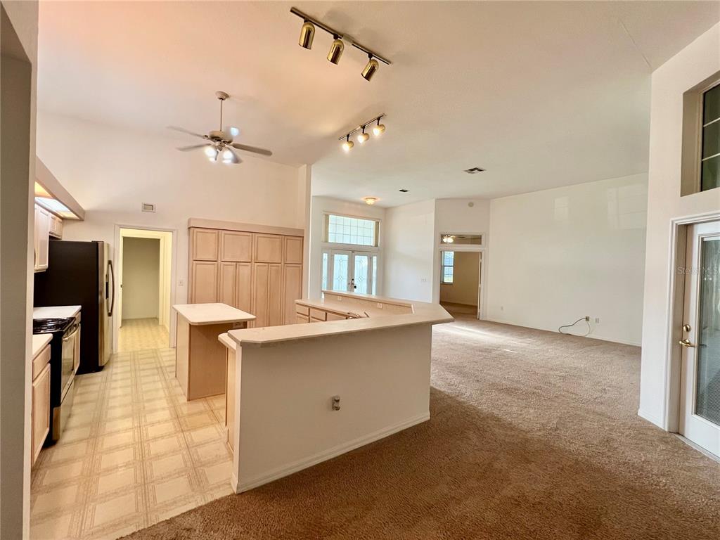 11159 Southwest 71st Terrace Road Ocala, FL 34476 - Photo 12 of 25 a kitchen with stainless steel appliances granite countertop a sink a stove and a refrigerator