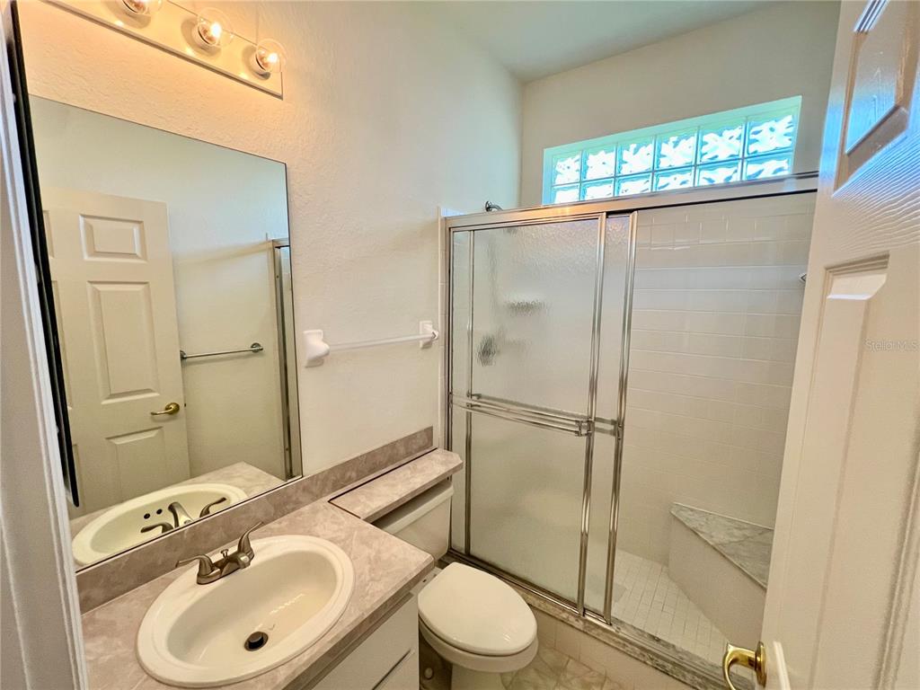 11159 Southwest 71st Terrace Road Ocala, FL 34476 - Photo 21 of 25 a bathroom with a sink toilet and shower