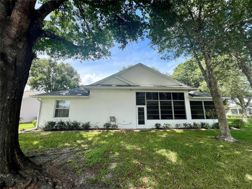 11159 Southwest 71st Terrace Road Ocala, FL 34476 - Photo 25 of 25 front view of a house with a yard