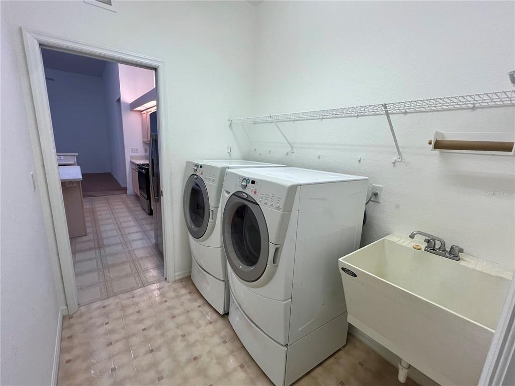 11159 Southwest 71st Terrace Road Ocala, FL 34476 - Photo 9 of 25 a utility room with dryer and washer