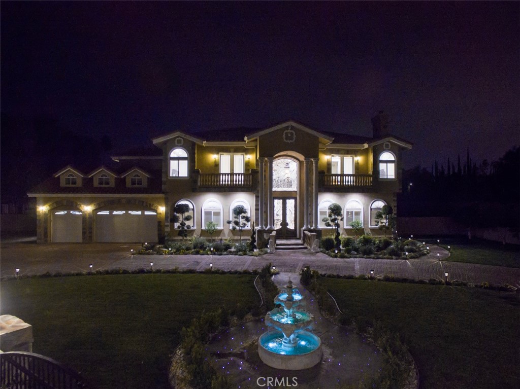 10062 Valley Cir Boulevard Chatsworth, CA 91311 - Photo 2 of 35 a large building with a big yard