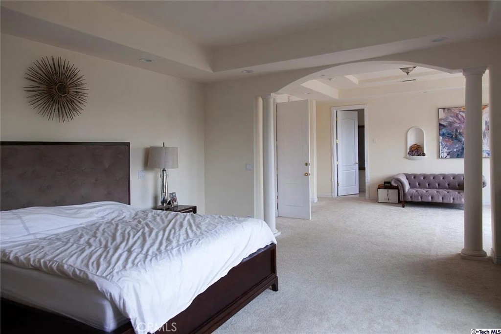 10062 Valley Cir Boulevard Chatsworth, CA 91311 - Photo 27 of 35 a bedroom with a bed and a couch