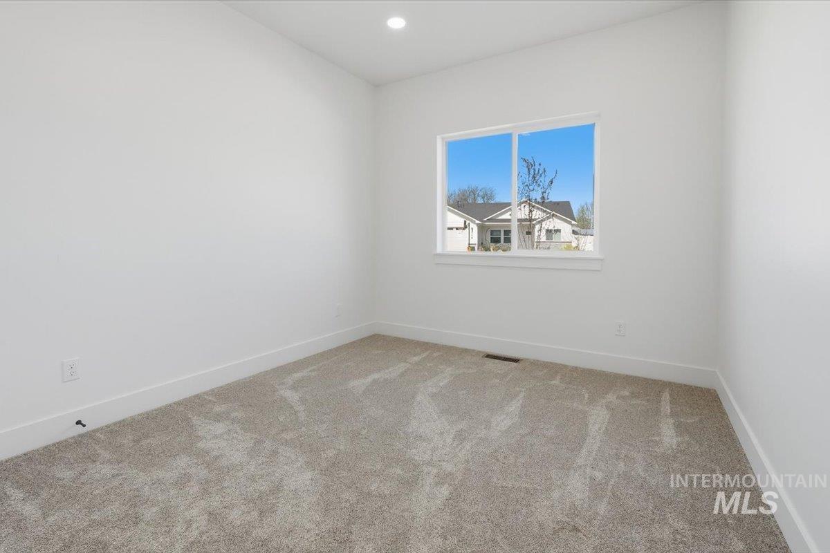 2173 Austin Way Fruitland, ID 83619 - Photo 11 of 28 Spare room with light carpet and recessed lighting