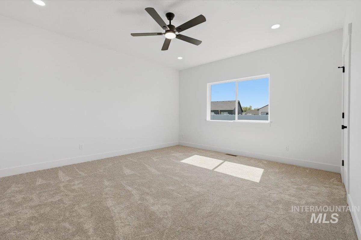 2173 Austin Way Fruitland, ID 83619 - Photo 16 of 28 Spare room with carpet floors, recessed lighting, and ceiling fan