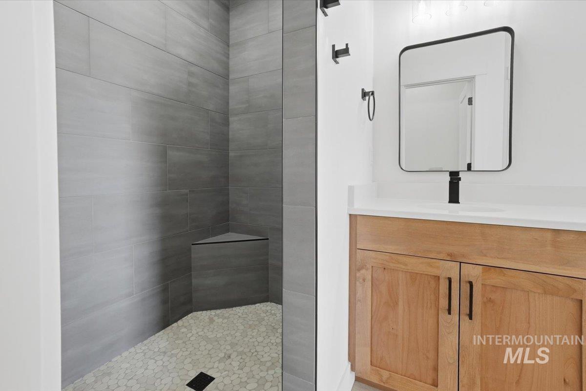 2173 Austin Way Fruitland, ID 83619 - Photo 20 of 28 Full bathroom featuring vanity and a walk in shower