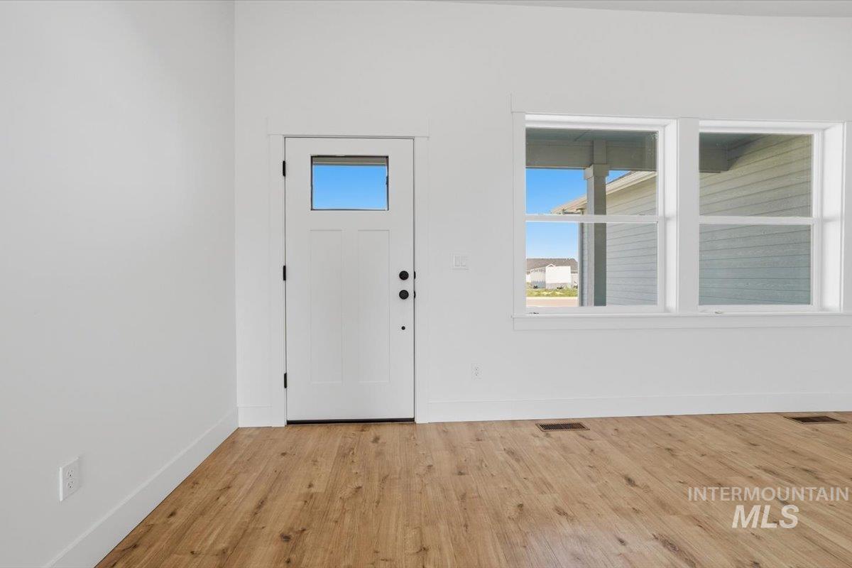 2173 Austin Way Fruitland, ID 83619 - Photo 5 of 28 Foyer entrance with light wood-type flooring and baseboards