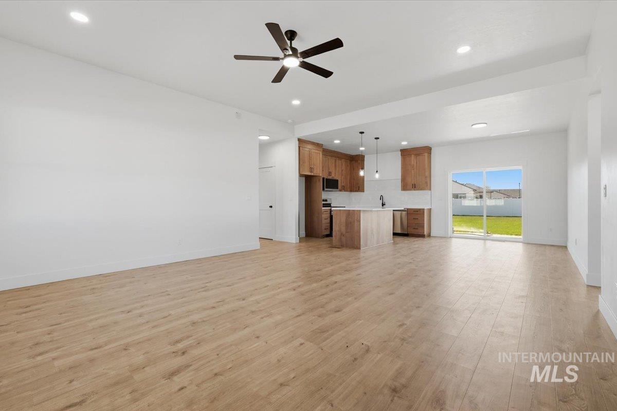 2173 Austin Way Fruitland, ID 83619 - Photo 6 of 28 Unfurnished living room with a ceiling fan, light wood-type flooring, and recessed lighting