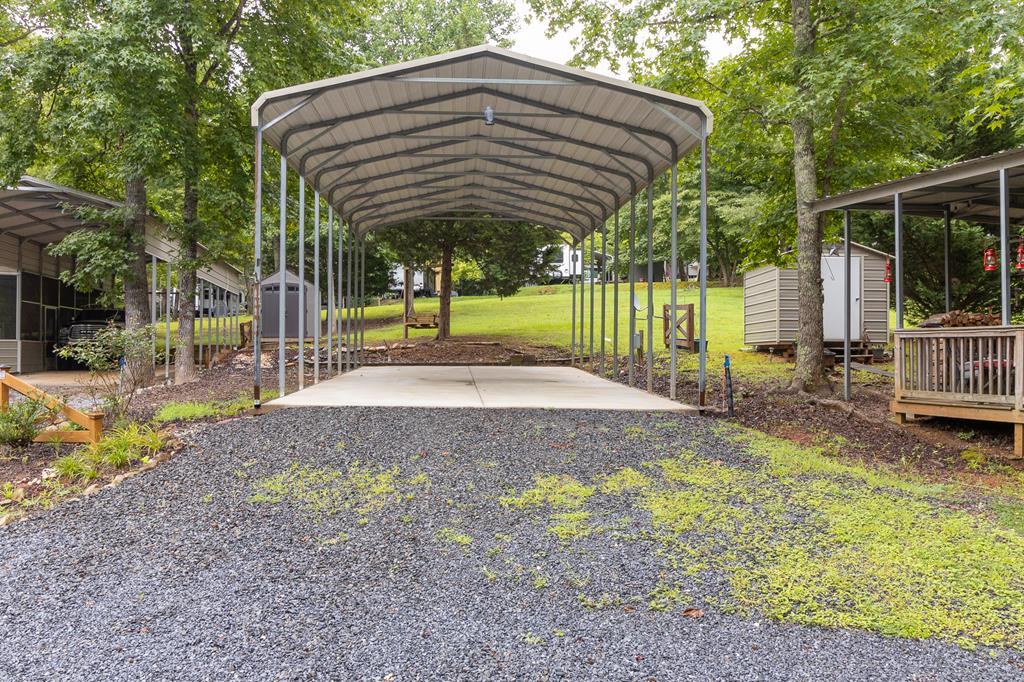 355-127 Peaceful Loop Chatsworth, GA 30705 - Photo 2 of 4 a view of a house with backyard and sitting area