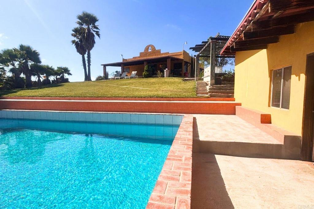 53 Tierra Santa Durham, OS 27707 - Photo 4 of 15 a view of swimming pool with an outdoor seating