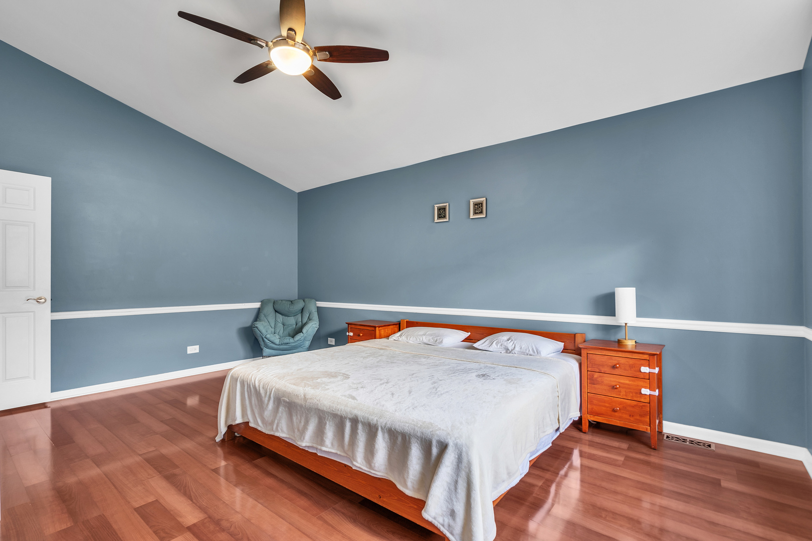 681 Legends Drive Carol Stream, IL 60188 - Photo 13 of 34 a bedroom with a bed and wooden floor