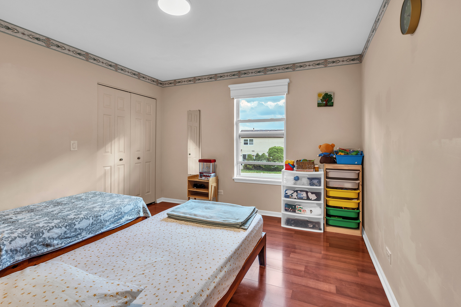 681 Legends Drive Carol Stream, IL 60188 - Photo 18 of 34 a bedroom with a bed and a dresser in it